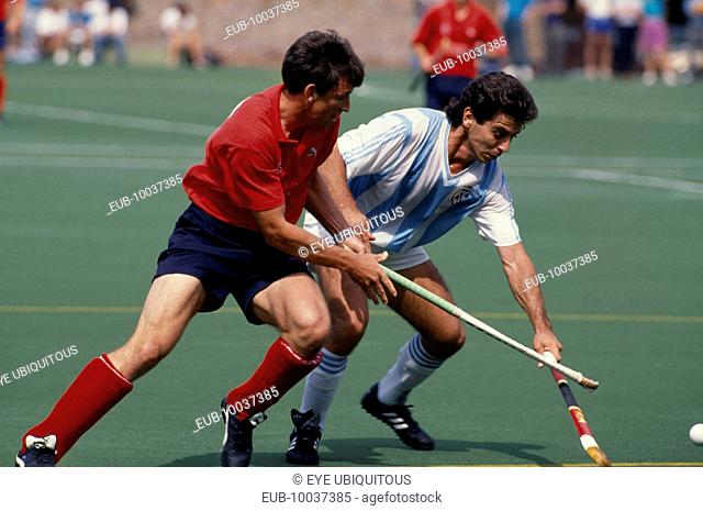 Two players from each team during a match between England and Argentina at Bisham Abbey