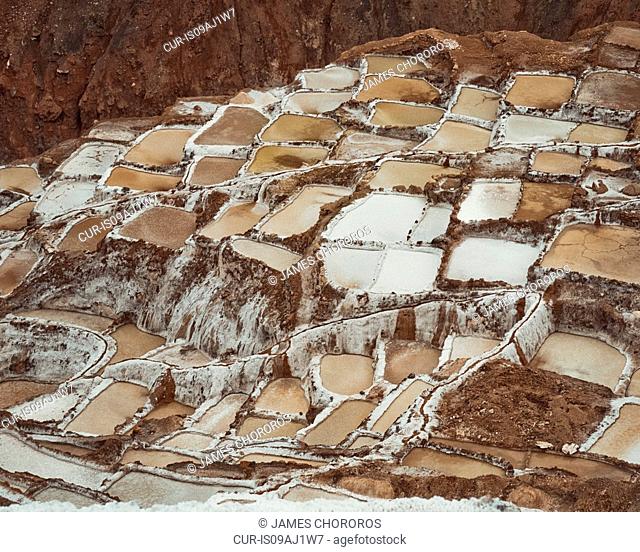 View of salt mines in mountains, Maras, Sacred Valley, Peru