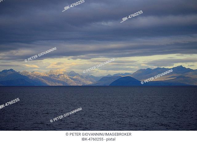 Coastal landscape with dark clouds, South Pacific, near Puerto Natales, Patagonia, Chile