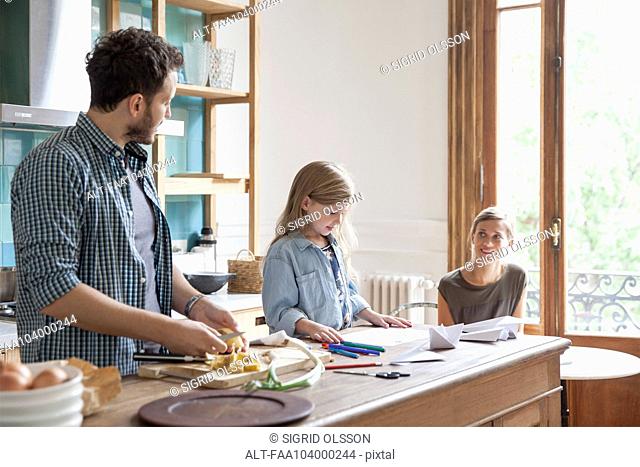Family spending time together in kitchen