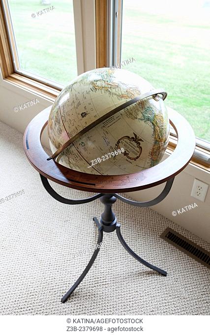 Globe by the window at a home in Sanford Lake, Michigan, USA
