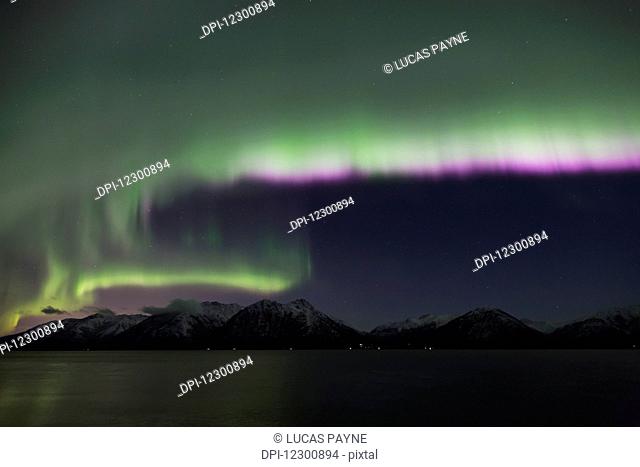 Aurora Borealis dancing above the Chugach Mountains and Turnagain Arm, Kenai Peninsula, Southcentral, Alaska