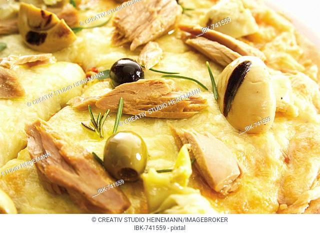 Pizza with tuna, olives and mushrooms