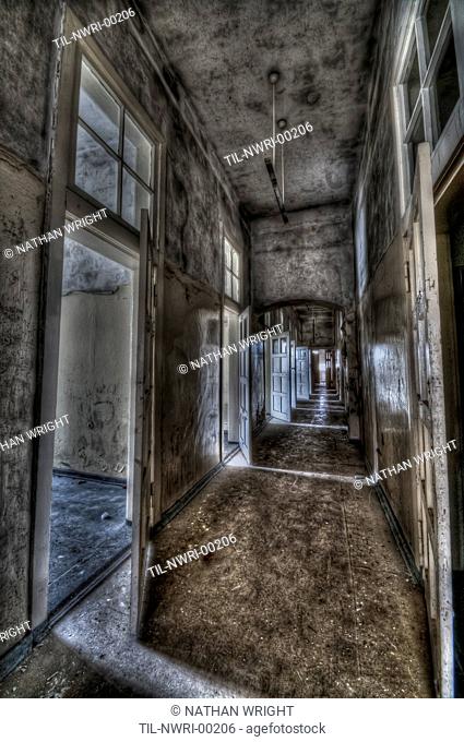 Abandoned lunatic asylum north of Berlin, Germany Empty corridor with open doors