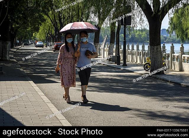 Couple walks at usually busy touristic area of Houhai lake in Beijing, China on 07/07/2020 The Chinese capital took strict measures to stop the spread of...
