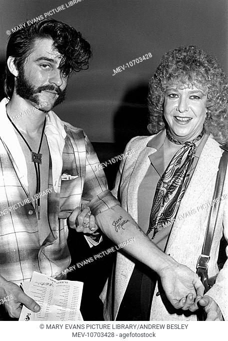 Janis Darlene Martin (1940-2007), American singer, nicknamed the Female Elvis, seen here with an admiring teddy boy who has her name tattooed on his arm