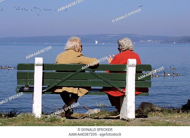 Senior Citizen Couple on Bench at Lakefront, Cayuga Lake, Ithaca, NY, Finger Lake
