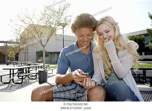 Couple looking at cell phone
