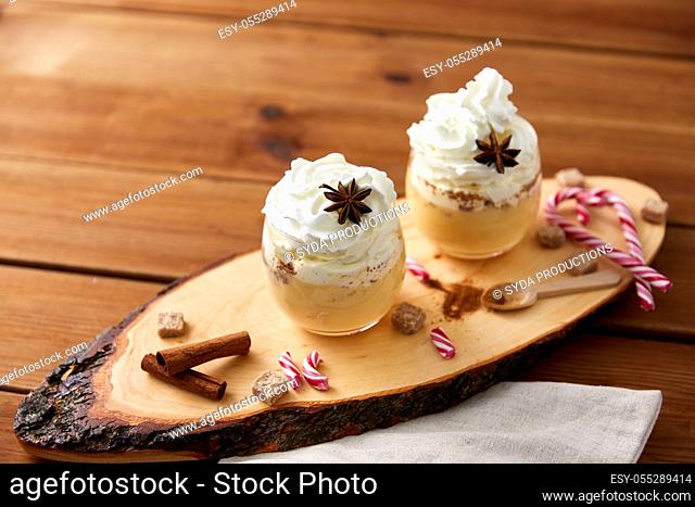 glasses of eggnog with whipped cream and anise