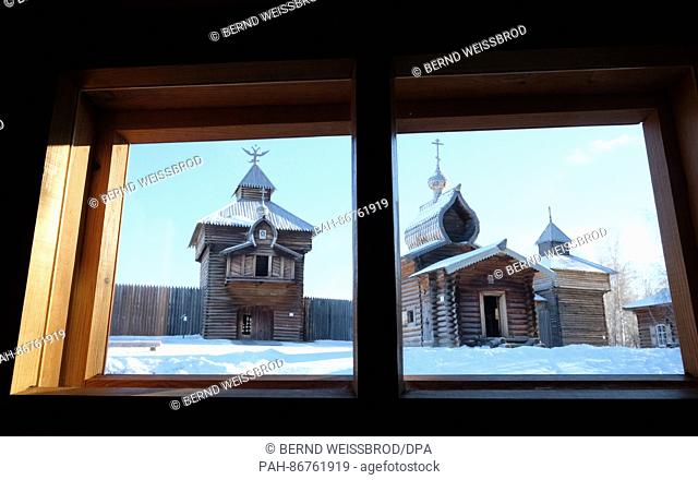 Historic wooden houses located in the open air Museum of Siberian log architecture in Talzi in Siberia, near Irkutsk, Russia 02 December 2016