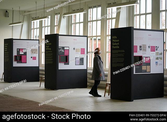 31 March 2022, Hamburg: A staff member walks through the exhibition ""Children in Bergen-Belsen Concentration Camp"" at the Neuengamme Concentration Camp...