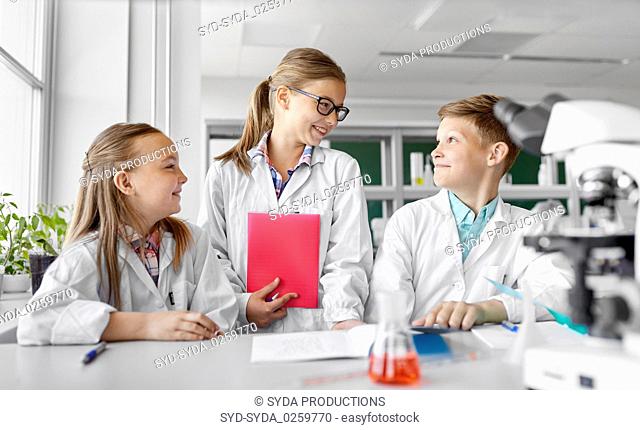 kids studying chemistry at school laboratory
