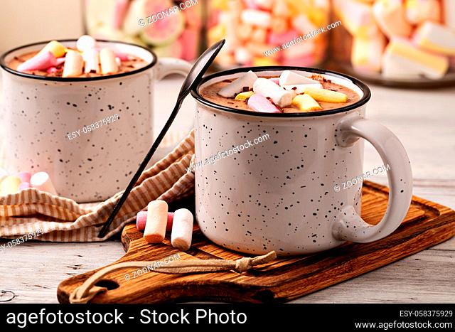 Hot chocolate with marshmallow in a cup on wooden background