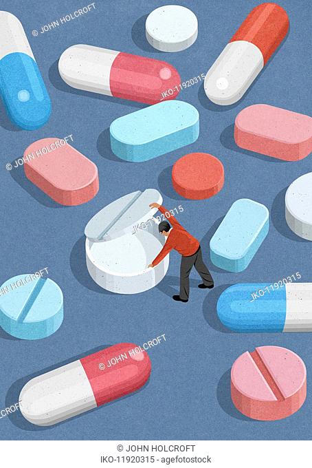 Man lifting lid on empty placebo pill
