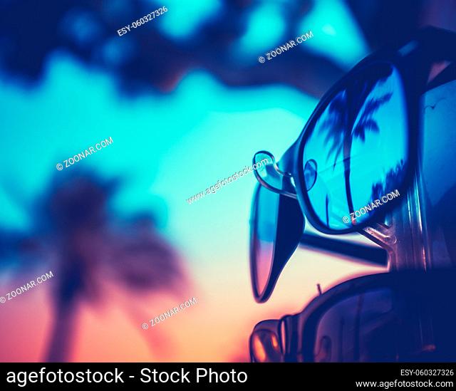 Retro Vintage Style Vacation Image Of Sunglasses For Sale At A Beach Resort WIth Palm Trees