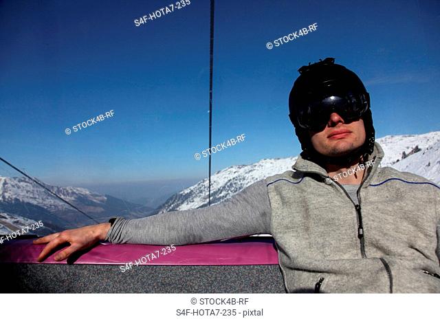 Man in chair lift, Hochfuegen, Zillertal, Tyrol, Austria