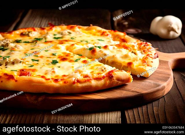 Delicious pizza with lots of melted cheese created with generative AI technology