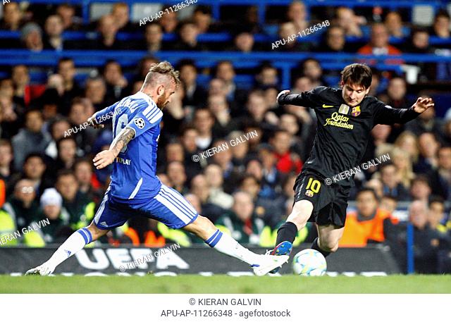 18 04 2012 Lionel Messi of Barcelona gets tackled by Chelseas Raul Meireles during the Champions League Semi Final 1st leg match between Chelsea and Barcelona...