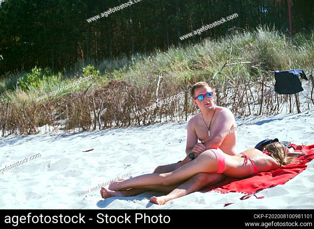 Poland, Chalupy in the Hel Peninsula at the Baltic sea 03.08.2015. Couple at the beach. photo CTK / Grzegorz Klatka
