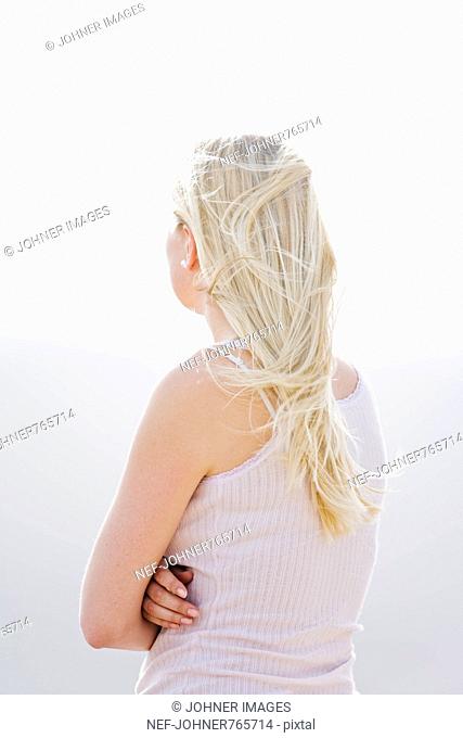 A blond woman from behind