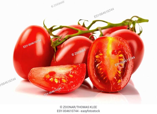 Fresh roma tomatoes cut on white background