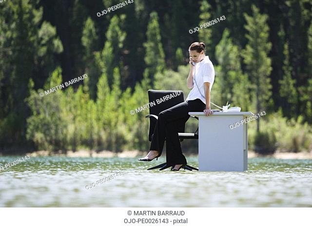 A woman on the phone on top of water