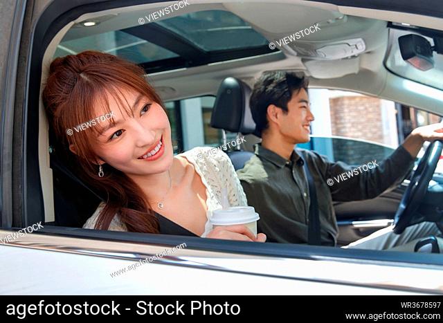 Young couples in the car