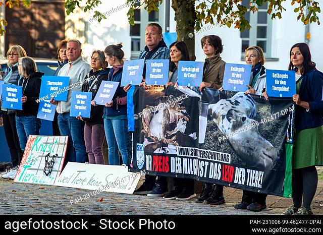 06 October 2023, Bavaria, Memmingen: Animal rights activists demonstrate against animal cruelty in front of the regional court