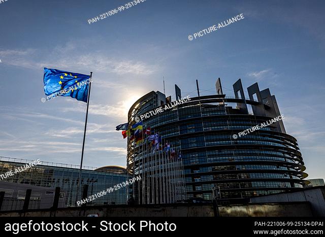 05 October 2022, France, Straßburg: The flags of the European Union, Ukraine and EU member states fly in front of the European Parliament building in Strasbourg