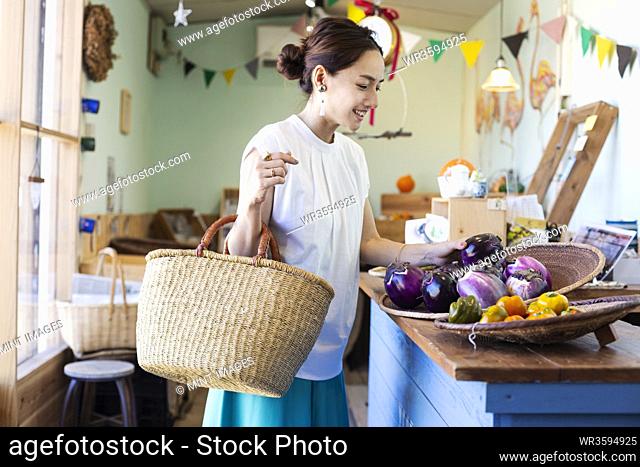 Japanese women shopping fresh vegetables in a farm shop
