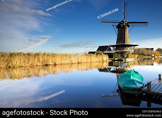 Windmill the Vriendschap along the river Graafstroom in the Dutch village Bleskensgraaf