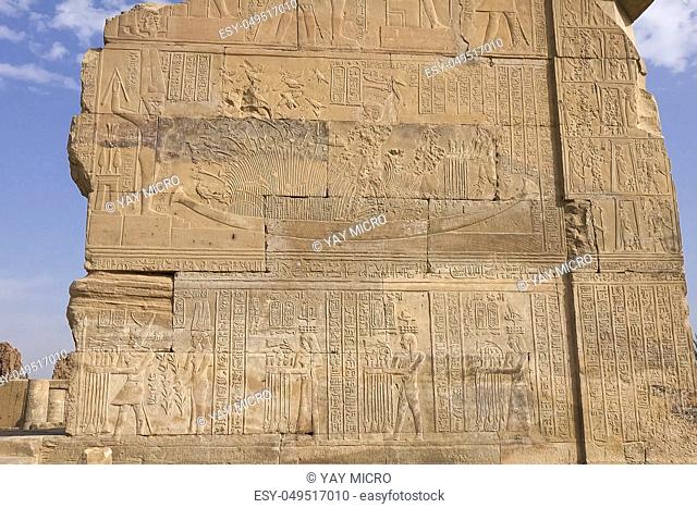 Egyptian hieroglyphs and drawings on the walls and columns. Egyptian language, The life of ancient gods and people in hieroglyphics and drawings