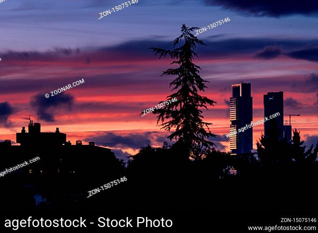 Madrid, Spain - February 17, 2020: Dramatic sunset on Madrid skyline financial district