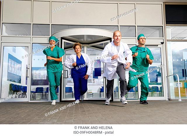 Medical team rushing out of door