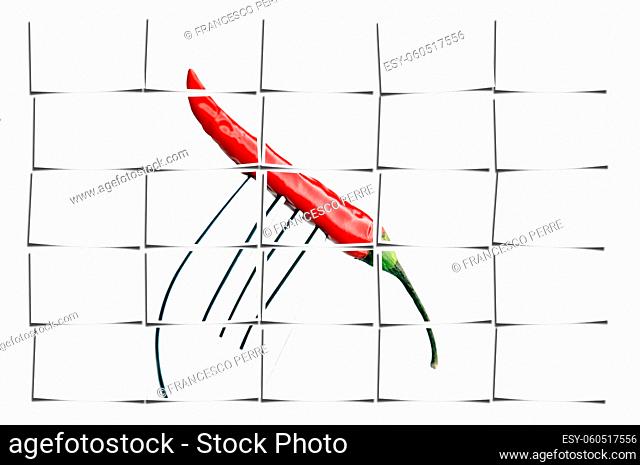 red chili pepper on a fork , on white background