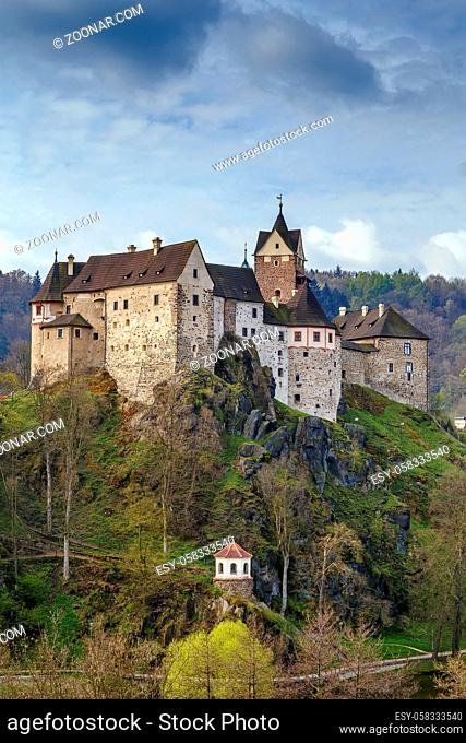Loket Castle is a 12th-century Gothic style castle about 12 kilometres from Karlovy Vary on a massive rock in the town of Loket, Czech Republic