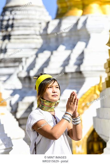Asian woman doing traditional dance at temple