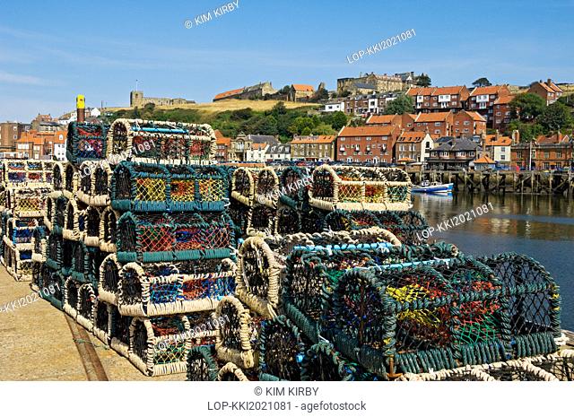 England, North Yorkshire, Whitby. Crab pots stacked on the quayside