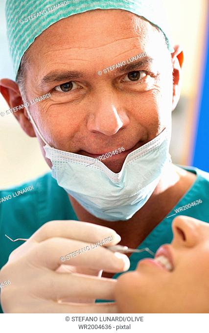 Portrait of a male dentist at work