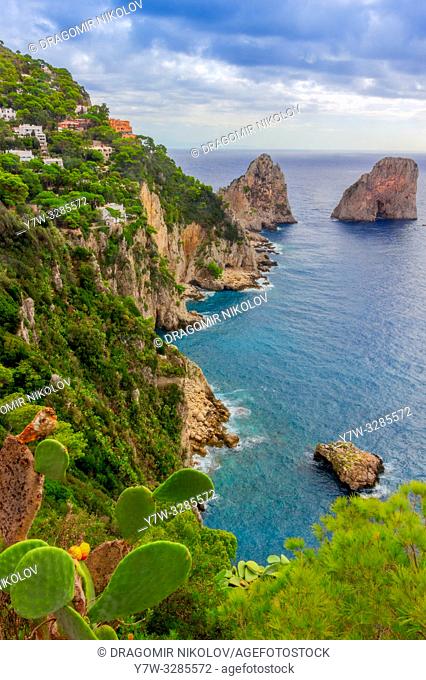 Sea view by Capri island, Italy. The rocks are famous as Faraglioni rock. Locals say that they have seen sirens on this rock and often hear their whistling