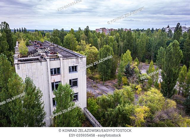 Former administration building seen from Polissya Hotel in Pripyat ghost city of Chernobyl Nuclear Power Plant Zone of Alienation in Ukraine