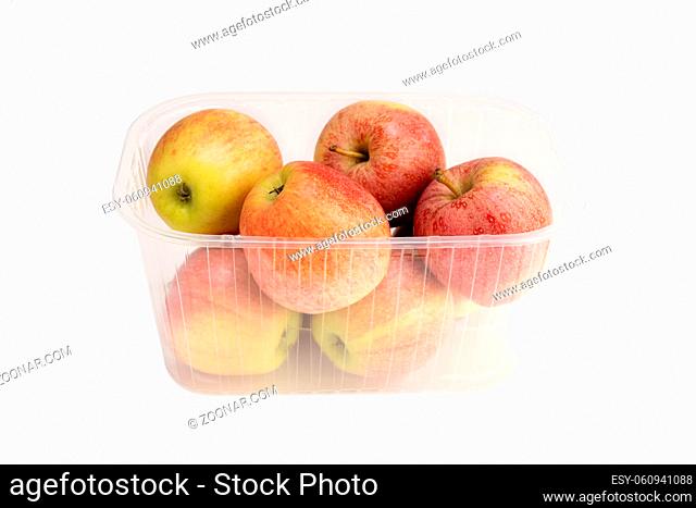 Apples in a plastic box isolated on white background