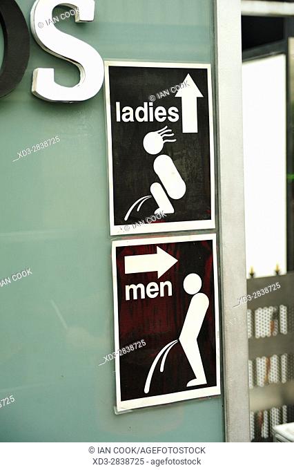 Public toilet signs in rooftop bar, Kuala Lumpur, Malaysia