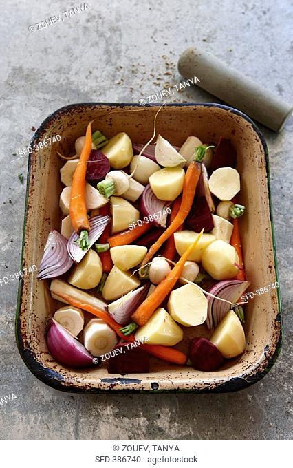 Vegetables potatoes, carrots, onions, ready for roasting