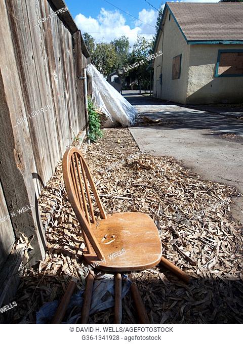 A collapsed chair in the backyard of a foreclosed house in Fresno, California, United states