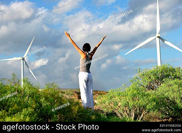 Man and woman lifting arm near wind back