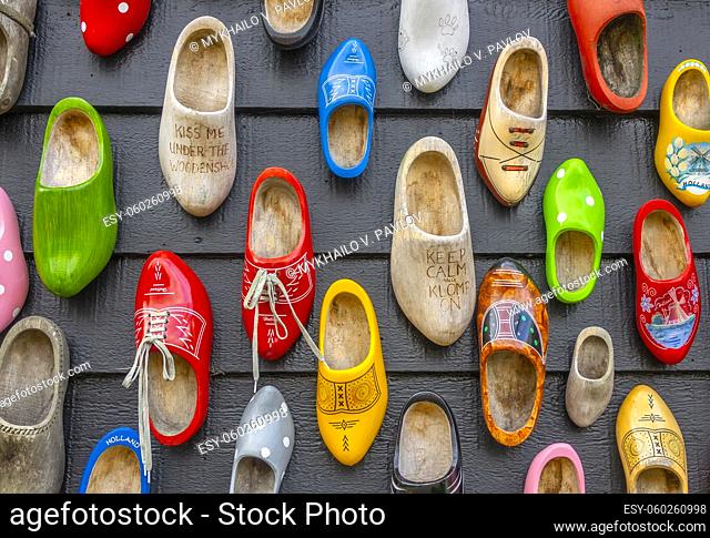 Netherlands. Zaanse Schans. Many different clogs hang on the wall of a wooden house