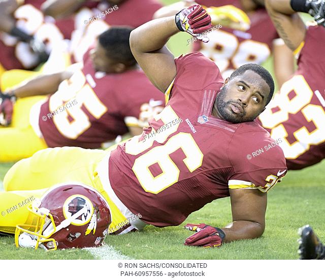Washington Redskins running back Darrel Young (36) participates in calisthenics as he warms-up prior to the game against the Detroit Lions at FedEx Field in...