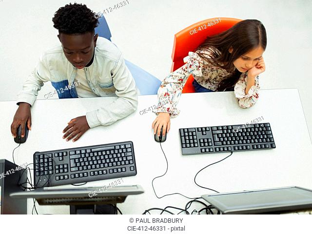 Junior high students using computers in computer lab