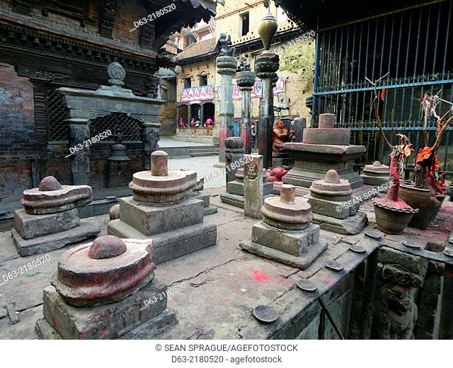 Nepal. Bakhtapur, an historic town in the Kathmandu Valley and UNESCO world heritage site. Vishnu temple. Shiva lingam statues